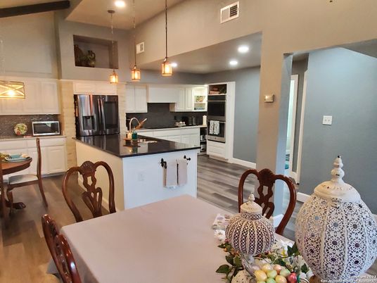 Dining room, Interior, Kitchen, Pendant Lights, Recessed Lighting, Stainless Steel Appliances, Wood Texture Flooring