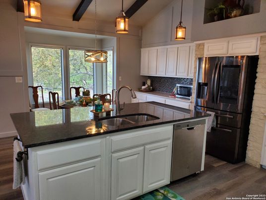 Dining room, Interior, Kitchen, Pendant Lights, Stainless Steel Appliances, Wood Texture Flooring