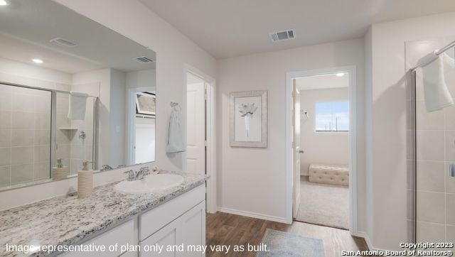Bathroom, Dual Sink Vanities, Interior, Recessed Lighting, Wood Texture Flooring