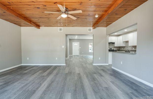 Empty room, Interior, Kitchen, Recessed Lighting, Stainless Steel Appliances, Wooden Beams, Wooden Ceilings, Wood Texture Flooring