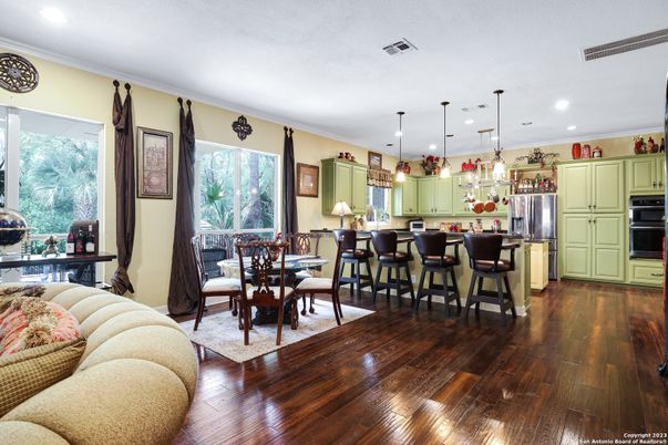 Dining room, Interior, Kitchen, Pendant Lights, Recessed Lighting, Stainless Steel Appliances, Wood Texture Flooring