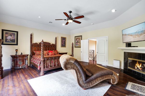 Bedroom, Fireplace, Interior, Recessed Lighting, Wood Texture Flooring