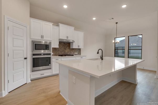 Chandelier, Interior, Kitchen, Pendant Lights, Recessed Lighting, Stainless Steel Appliances, Wood Texture Flooring