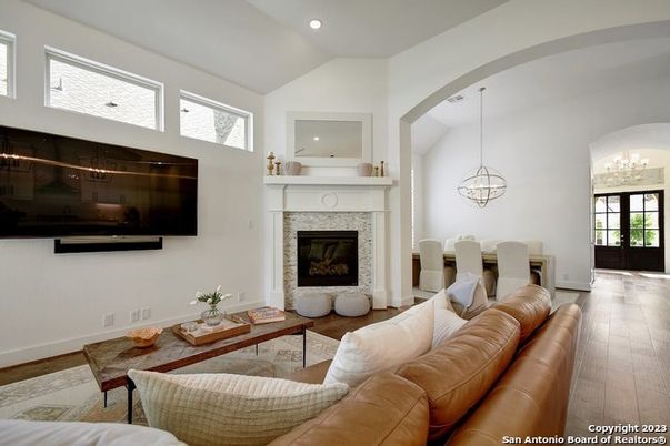 Dining room, Fireplace, Interior, Living room, Pendant Lights, Recessed Lighting, Wood Texture Flooring