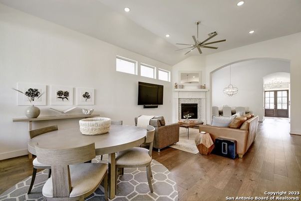 Dining room, Fireplace, Interior, Living room, Pendant Lights, Recessed Lighting, Wood Texture Flooring