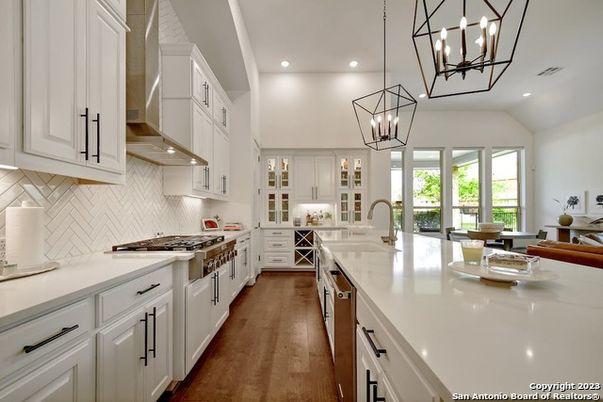 Chandelier, Interior, Kitchen, Pendant Lights, Recessed Lighting, Stainless Steel Appliances, Wood Texture Flooring