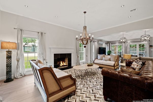 Chandelier, Fireplace, Interior, Living room, Recessed Lighting, Wood Texture Flooring