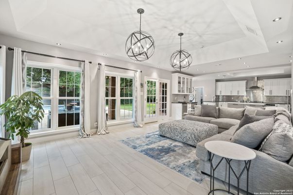 Chandelier, Interior, Kitchen, Living room, Pendant Lights, Recessed Lighting, Stainless Steel Appliances, Wood Texture Flooring