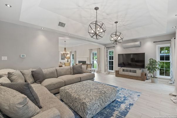 Chandelier, Fireplace, Interior, Living room, Pendant Lights, Recessed Lighting, Wood Texture Flooring