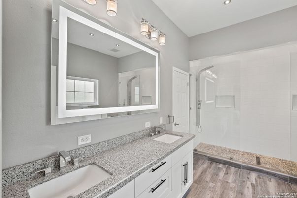 Bathroom, Dual Sink Vanities, Glass Shower, Interior, Recessed Lighting, Wood Texture Flooring