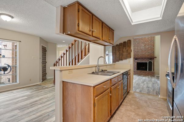 Fireplace, Interior, Kitchen, Recessed Lighting, Wood Texture Flooring