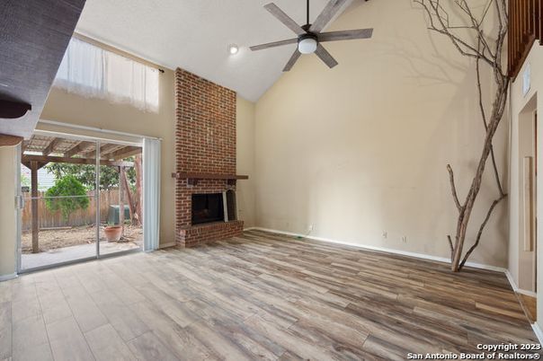 Empty room, Fireplace, Interior, Recessed Lighting, Stone Walls, Wood Texture Flooring