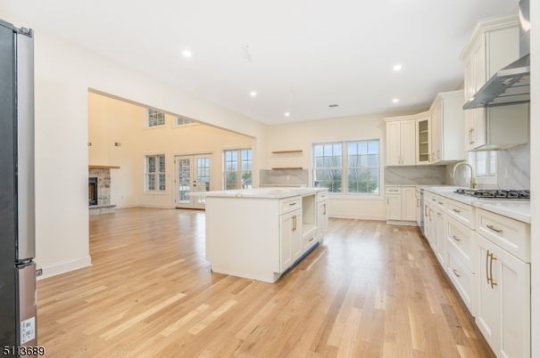 Fireplace, Interior, Kitchen, Recessed Lighting, Stainless Steel Appliances, Wood Texture Flooring