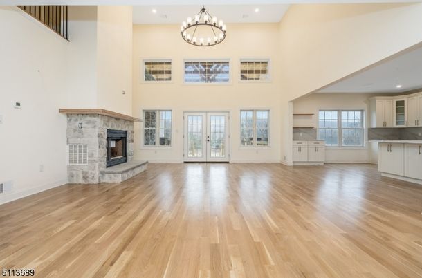 Chandelier, Empty room, Fireplace, Interior, Recessed Lighting, Wood Texture Flooring
