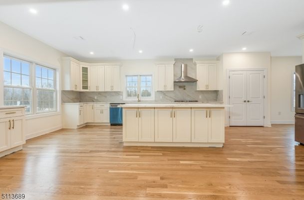 Interior, Kitchen, Marble Walls, Recessed Lighting, Stainless Steel Appliances, Wood Texture Flooring
