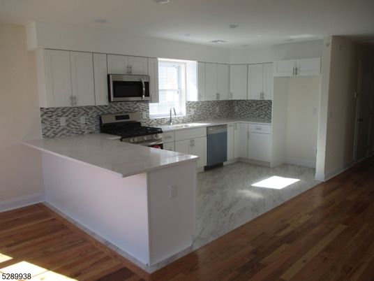 Interior, Kitchen, Marble, Recessed Lighting, Stainless Steel Appliances, Wood Texture Flooring