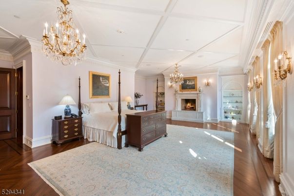 Bedroom, Chandelier, Fireplace, Interior, Recessed Lighting, Wood Texture Flooring