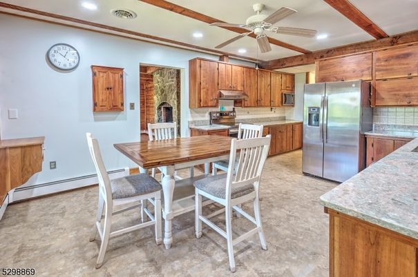 Dining room, Fireplace, Interior, Kitchen, Recessed Lighting, Stainless Steel Appliances, Wooden Beams