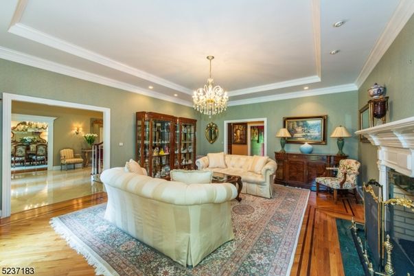 Chandelier, Fireplace, Interior, Living room, Recessed Lighting, Wood Texture Flooring