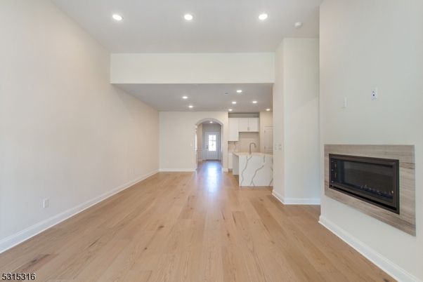 Empty room, Fireplace, Interior, Kitchen, Recessed Lighting, Wood Texture Flooring