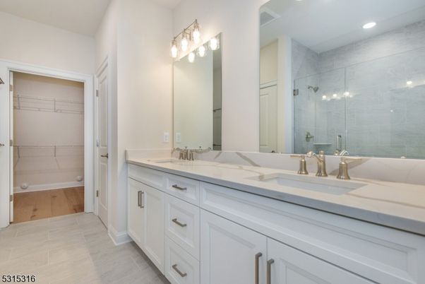 Bathroom, Dual Sink Vanities, Glass Shower, Interior, Recessed Lighting, Walk-in Closets, Wood Texture Flooring