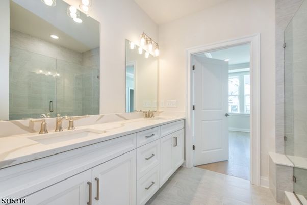 Bathroom, Dual Sink Vanities, Glass Shower, Interior, Recessed Lighting, Wood Texture Flooring