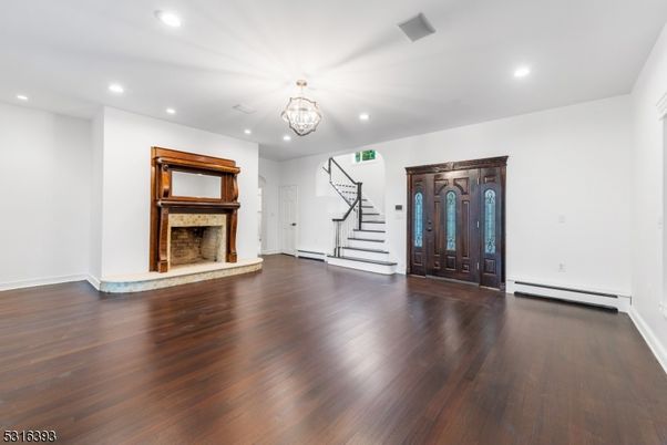 Chandelier, Empty room, Fireplace, Interior, Recessed Lighting, Wood Texture Flooring