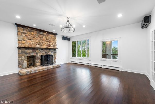 Empty room, Fireplace, Interior, Recessed Lighting, Stone Walls, Wood Texture Flooring
