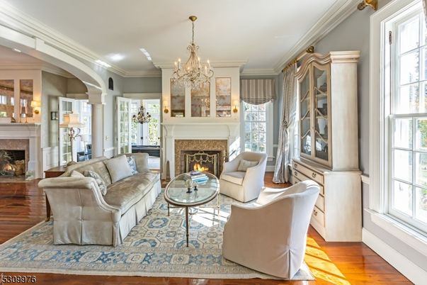 Chandelier, Fireplace, Interior, Living room, Recessed Lighting, Wood Texture Flooring