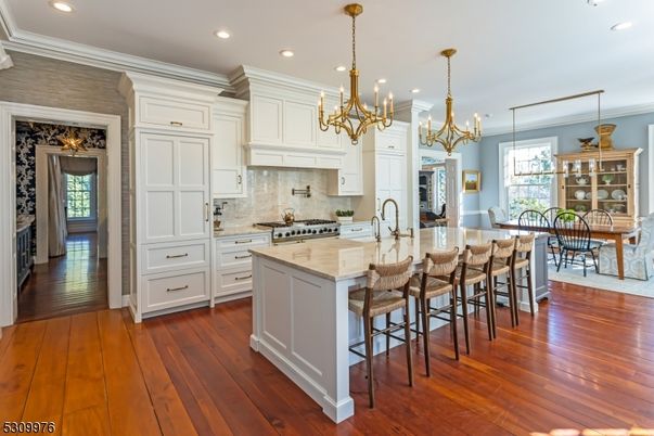 Chandelier, Dining room, Interior, Kitchen, Recessed Lighting, Stainless Steel Appliances, Wood Texture Flooring