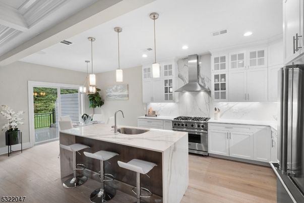 Interior, Kitchen, Marble Walls, Pendant Lights, Recessed Lighting, Stainless Steel Appliances, Wood Texture Flooring