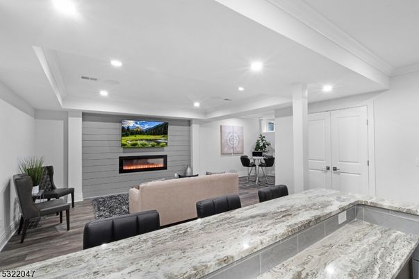 Fireplace, Interior, Living room, Piano, Recessed Lighting, Wood Texture Flooring