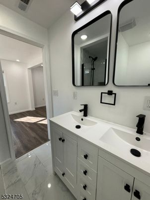 Bathroom, Dual Sink Vanities, Interior, Marble, Recessed Lighting, Wood Texture Flooring