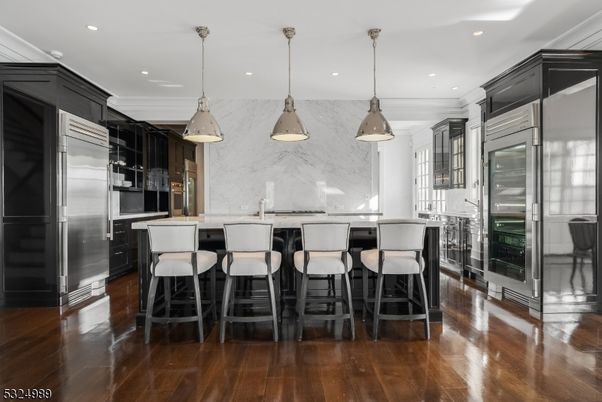 Interior, Kitchen, Marble Walls, Pendant Lights, Recessed Lighting, Stainless Steel Appliances, Wood Texture Flooring
