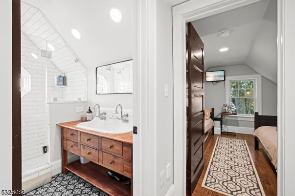Bathroom, Dual Sink Vanities, Interior, Recessed Lighting, Wood Texture Flooring