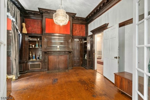 Chandelier, Fireplace, Interior, Piano, Wood Texture Flooring, Wooden Walls