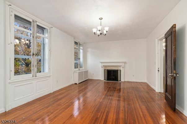 Chandelier, Empty room, Fireplace, Interior, Wood Texture Flooring