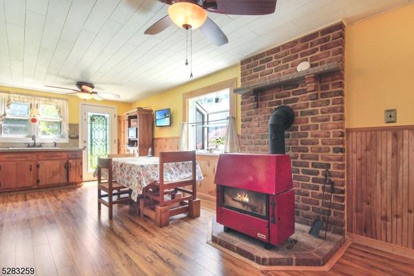 Dining room, Fireplace, Interior, Stone Walls, Wood Texture Flooring