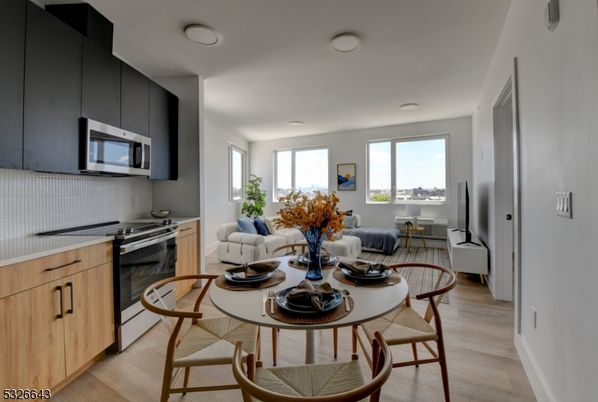 Dining room, Interior, Kitchen, Living room, Recessed Lighting, Stainless Steel Appliances, Wood Texture Flooring