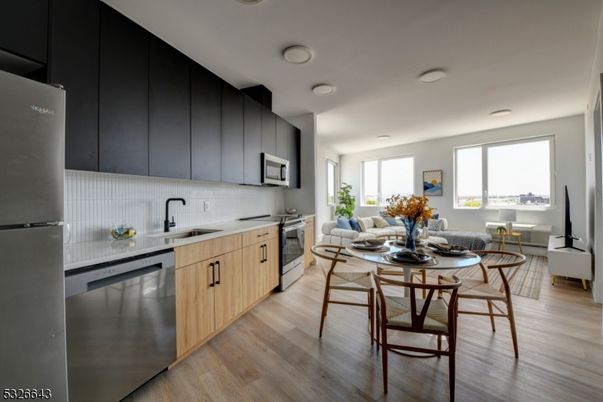 Dining room, Interior, Kitchen, Living room, Recessed Lighting, Stainless Steel Appliances, Wood Texture Flooring