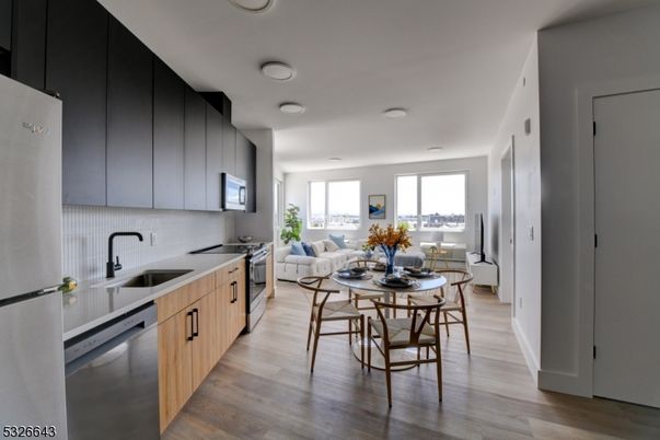 Dining room, Interior, Kitchen, Living room, Recessed Lighting, Stainless Steel Appliances, Wood Texture Flooring