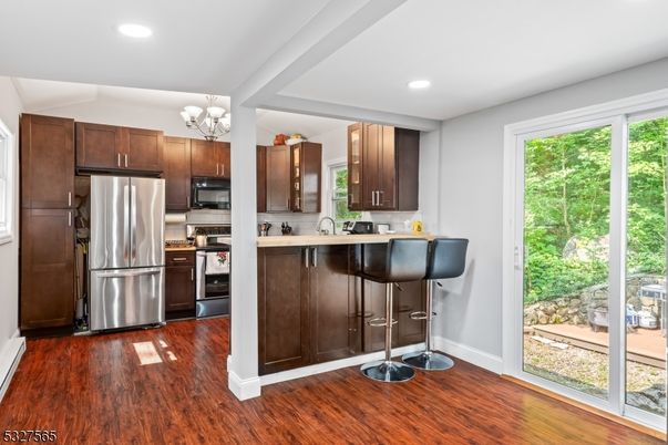 Chandelier, Interior, Kitchen, Recessed Lighting, Stainless Steel Appliances, Wood Texture Flooring