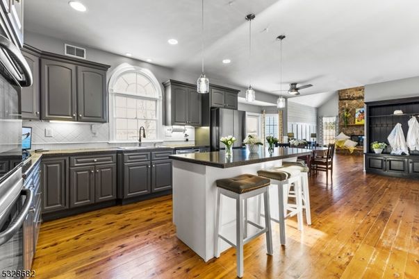 Dining room, Interior, Kitchen, Pendant Lights, Recessed Lighting, Stainless Steel Appliances, Wood Texture Flooring
