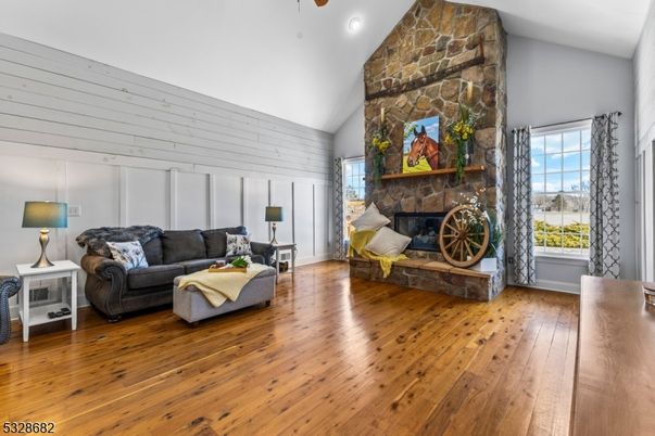 Fireplace, Interior, Living room, Recessed Lighting, Stone Walls, Wood Texture Flooring