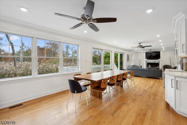 Dining room, Fireplace, Interior, Living room, Recessed Lighting, Wood Texture Flooring