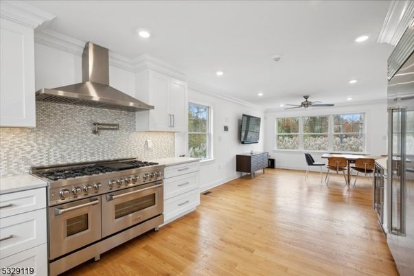 Dining room, Interior, Kitchen, Recessed Lighting, Stainless Steel Appliances, Wood Texture Flooring