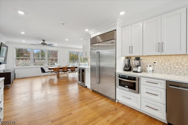 Dining room, Interior, Kitchen, Recessed Lighting, Stainless Steel Appliances, Wood Texture Flooring
