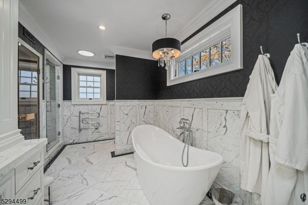 Bathroom, Chandelier, Free Standing Baths, Glass Shower, Interior, Marble, Marble Walls, Recessed Lighting