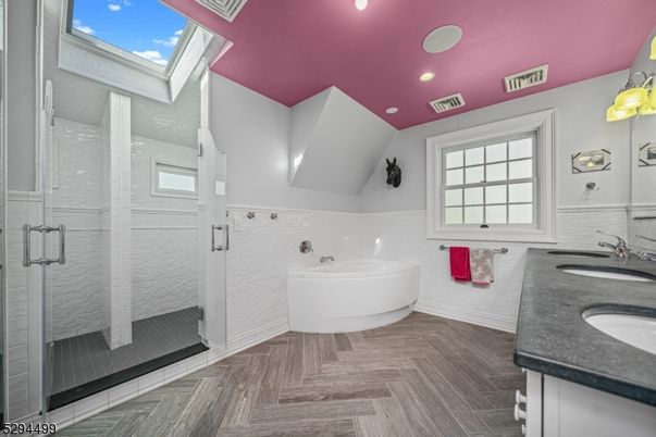 Bathroom, Dual Sink Vanities, Glass Shower, Interior, Recessed Lighting, Wood Texture Flooring