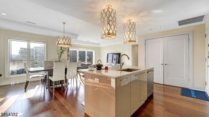 Chandelier, Dining room, Interior, Kitchen, Pendant Lights, Recessed Lighting, Stainless Steel Appliances, Wood Texture Flooring